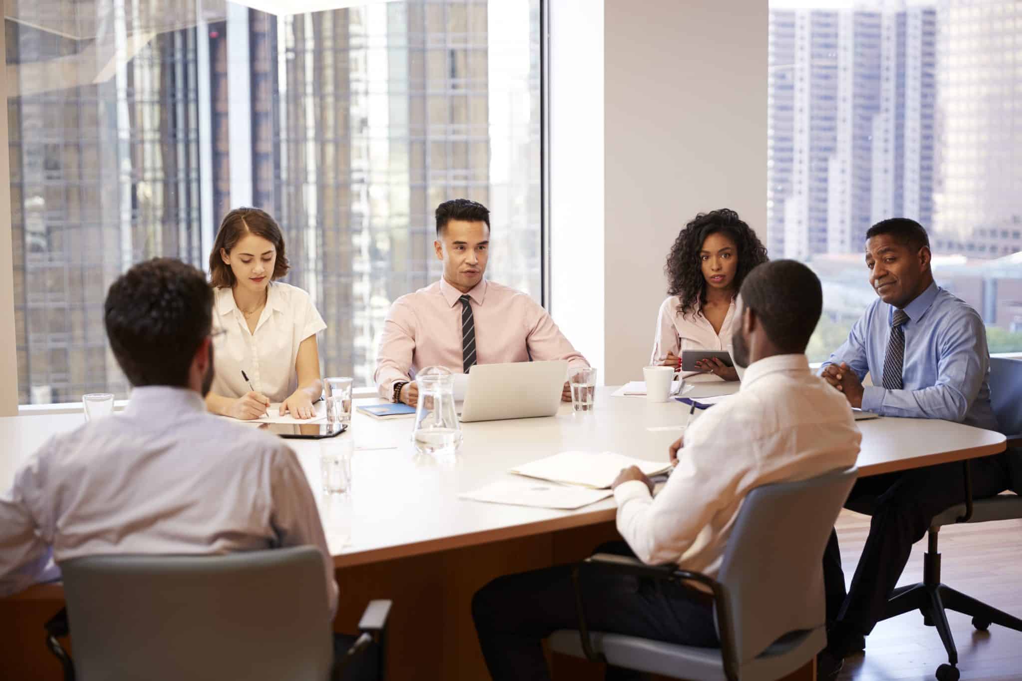 Group of professionals discussing in a Certified Development Company